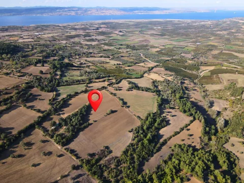 ÇANAKKALE 39.025M² TARLA DENİZ MANZARALI ORMANA SINIR KOOPERATİF YAPILABİLİR