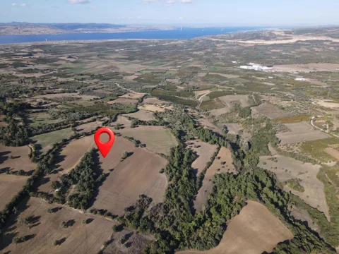 ÇANAKKALE 39.025M² TARLA DENİZ MANZARALI ORMANA SINIR KOOPERATİF YAPILABİLİR